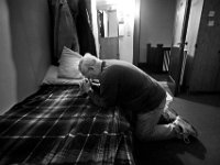 After an early morning (5am) wake up, David McCarthy, an Air Force veteran prays on his bed at the Veterans Transition House in New Bedford, MA.   The Veterans Transition house is non-profit and provides shelter and supportive services to veteran's who are homeless or who are dealing with addiction.  In the last month, two veterans have died from overdoses at the VTH.  This pice takes a look at life inside the Veterans Transition House.  PHOTO PETER PEREIRA
